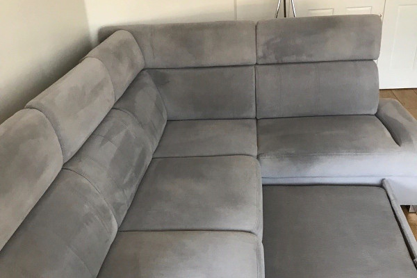 a freshly cleaned grey sofa