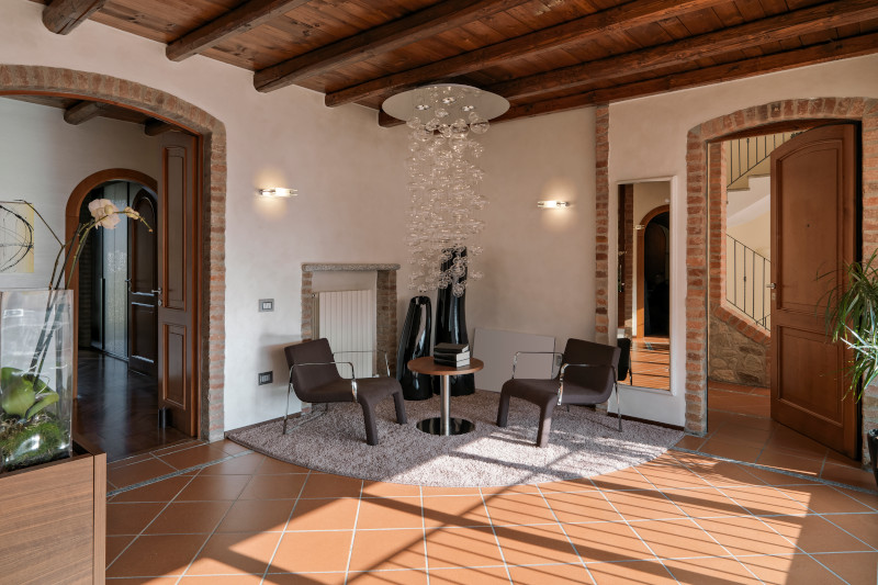 seating area in a rustic hotel with terracotta tiled floor